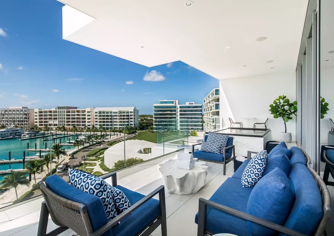 Albany luxury marina resort balcony with impact glass walls, Bahamas