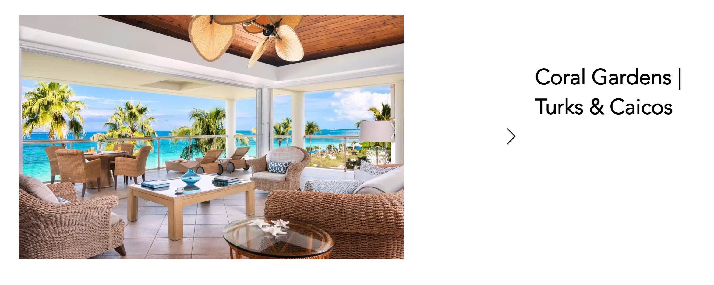 Coral Gardens beachfront living room with floor-to-ceiling impact glass, Turks & Caicos